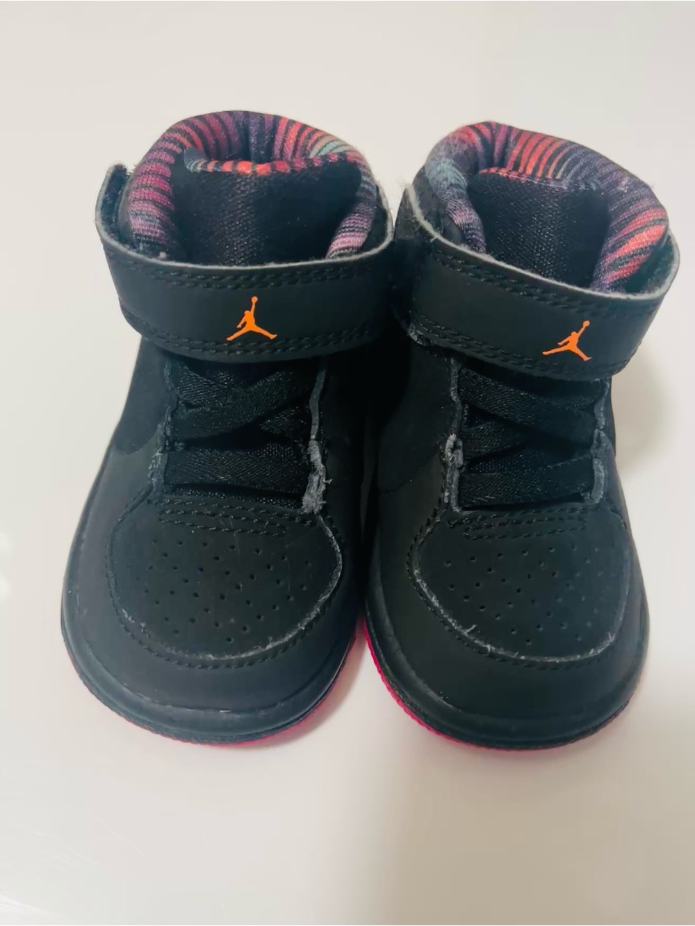 Nike Kids Black High-Top Sneakers with Orange Jumpman and Pink Accent